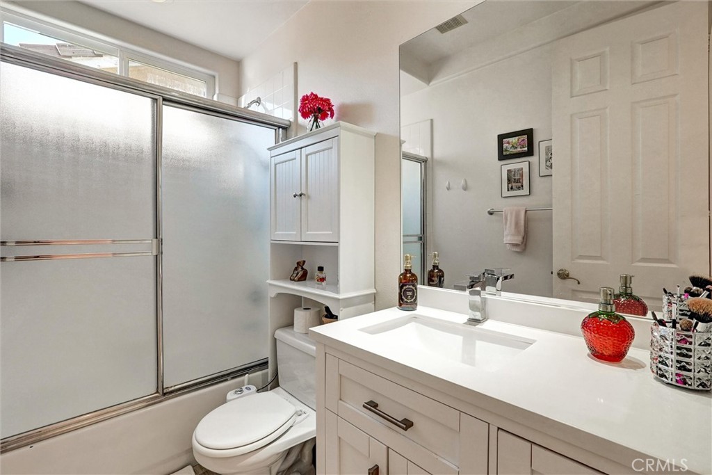 14079 Stagecoach Trail Moorpark, CA 93021 - Photo 25 of 47 a bathroom with a sink vanity mirror and toilet