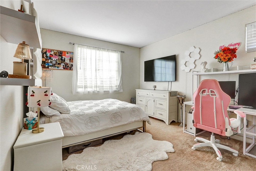 14079 Stagecoach Trail Moorpark, CA 93021 - Photo 26 of 47 a bedroom with bed and flat screen tv