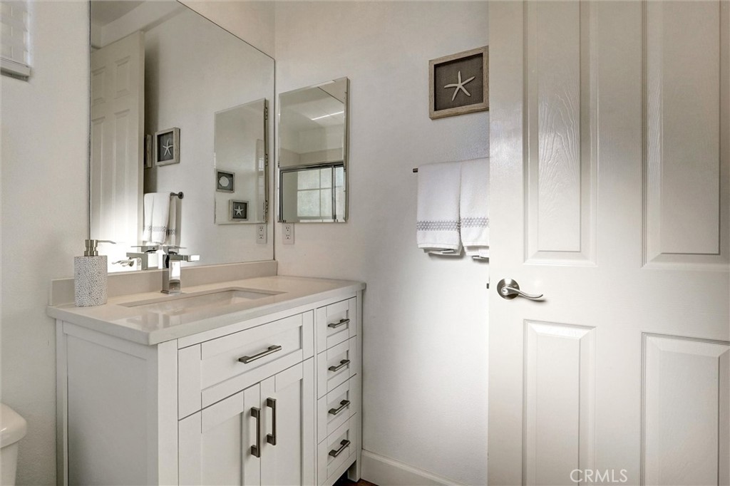 14079 Stagecoach Trail Moorpark, CA 93021 - Photo 29 of 47 a bathroom with a sink vanity and mirror