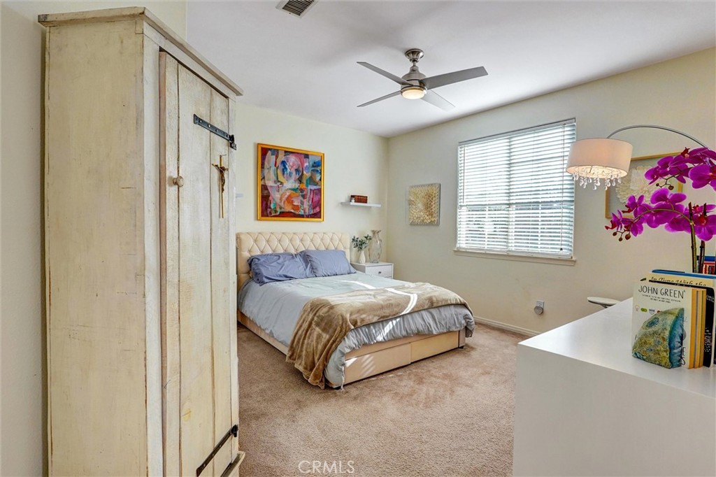 14079 Stagecoach Trail Moorpark, CA 93021 - Photo 30 of 47 a spacious bedroom with a bed dresser and window