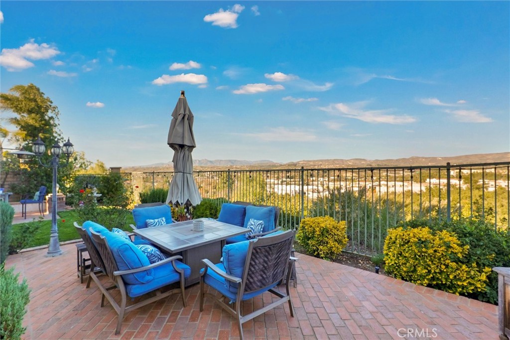 14079 Stagecoach Trail Moorpark, CA 93021 - Photo 43 of 47 a view of a chairs and table in patio with a lake view