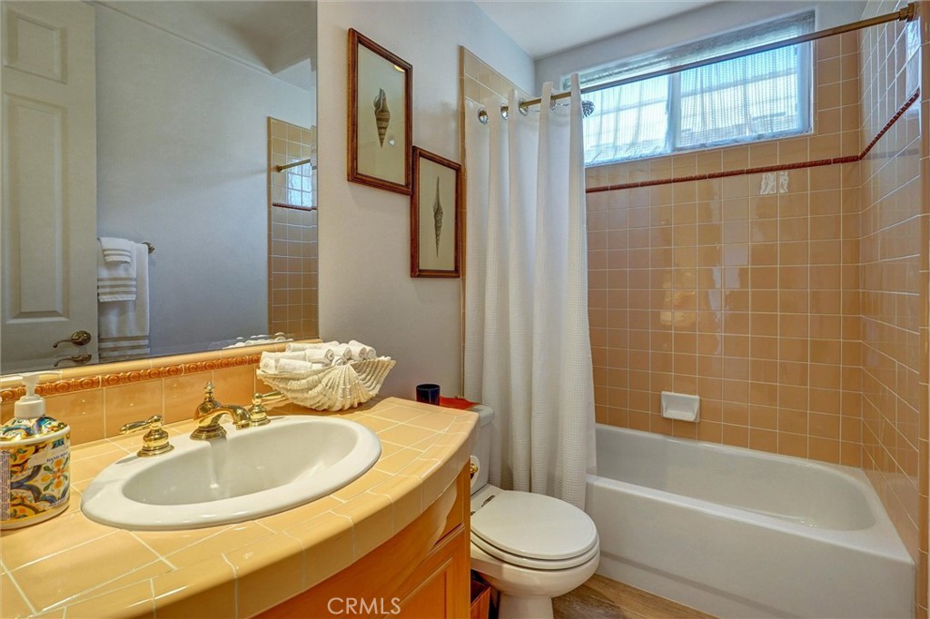 14079 Stagecoach Trail Moorpark, CA 93021 - Photo 9 of 47 a bathroom with a sink toilet and shower