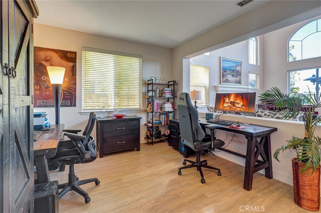 14079 Stagecoach Trail Moorpark, CA 93021 - Photo 10 of 47 a view of a workspace with furniture and a window