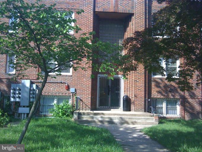 4236 Benning Road Northeast, Unit 302 Washington, DC 20019 - Photo 11 of 12 front view of a house with a yard