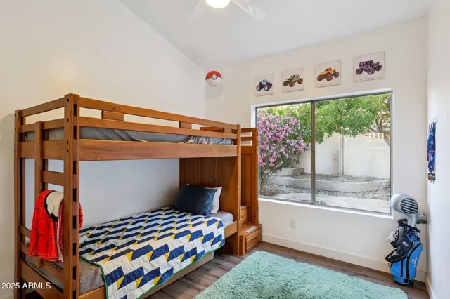 a bathroom with a granite countertop sink shower and a mirror