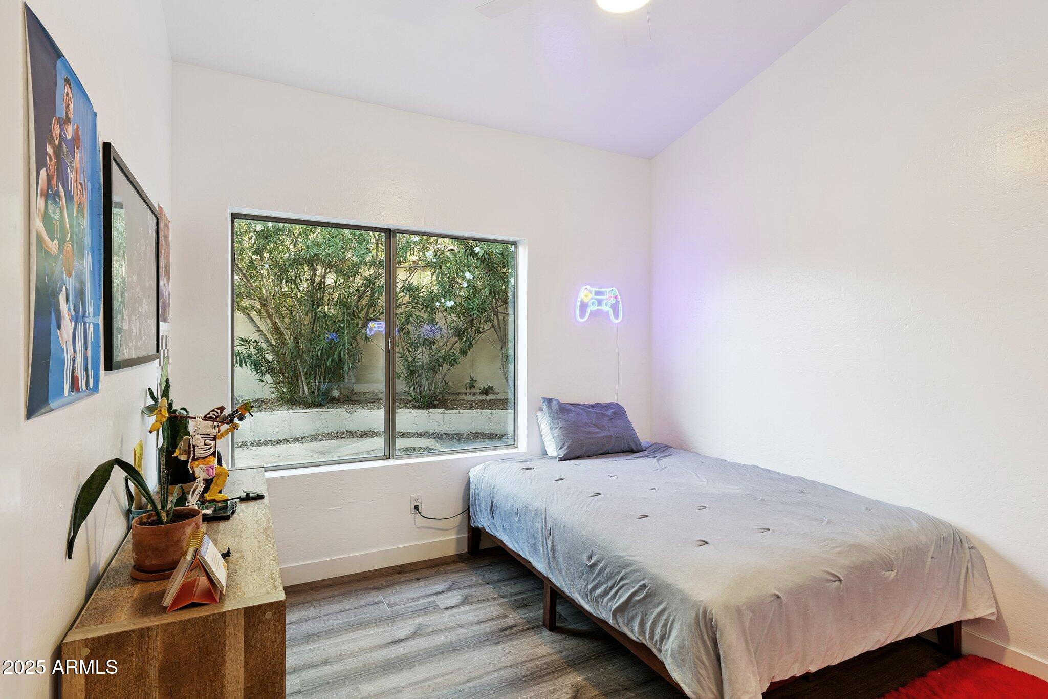 15608 South 7th Street Phoenix, AZ 85048 - Photo 19 of 30 a bedroom with a bed and a large window