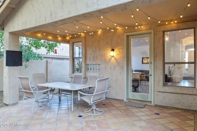 a outdoor dining space with furniture and a potted plant