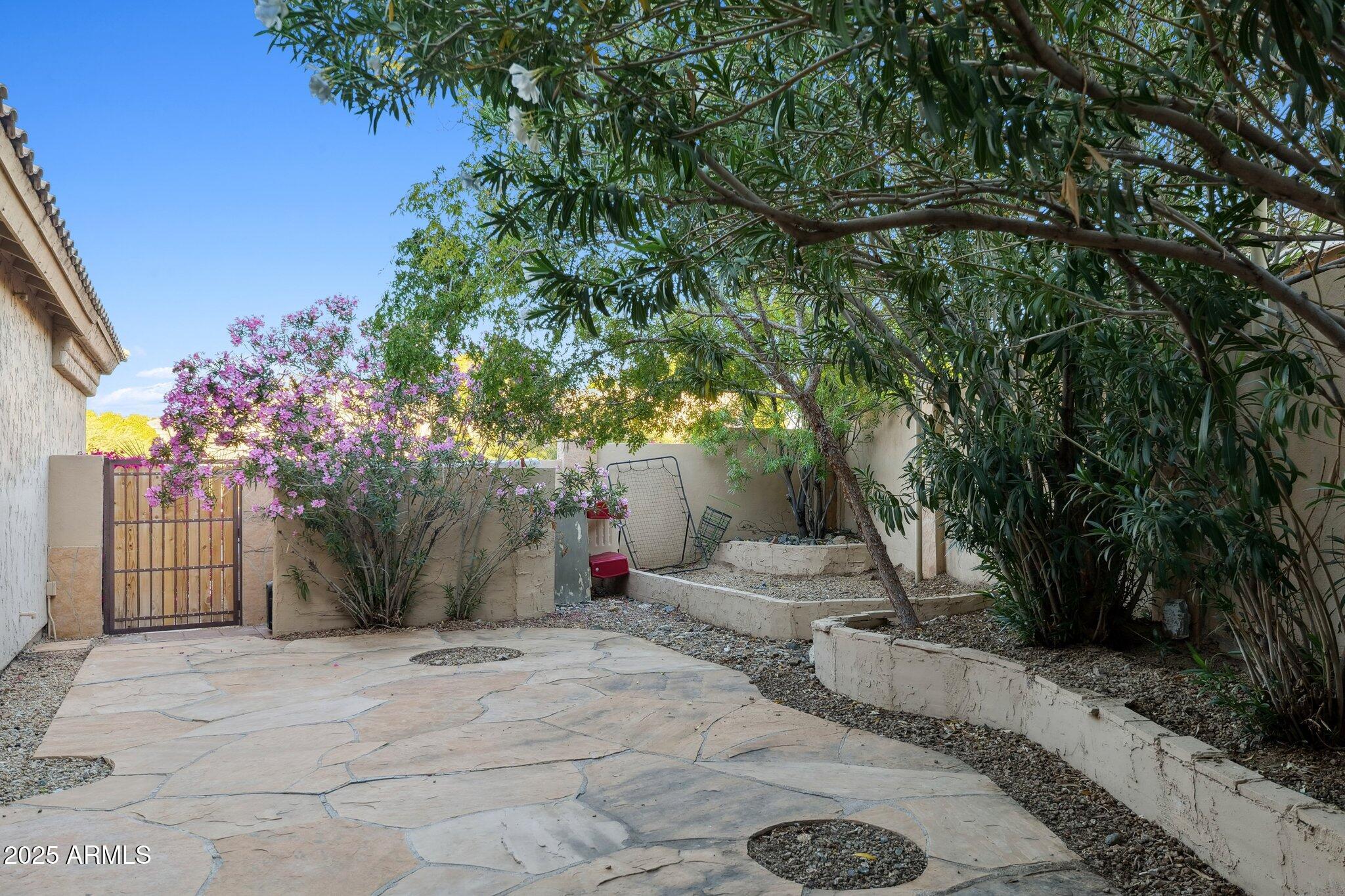 15608 South 7th Street Phoenix, AZ 85048 - Photo 27 of 30 a view of a backyard with sitting area