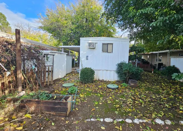 a backyard of a house with lots of green space