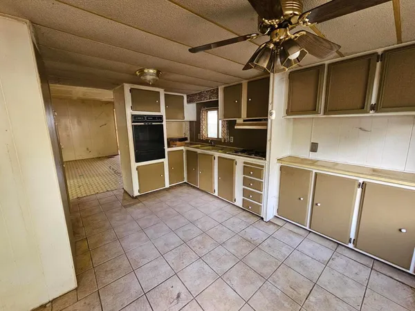 a view of a kitchen with electric appliances