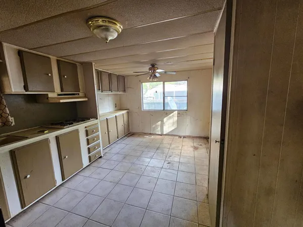 a view of a kitchen with a sink and dishwasher
