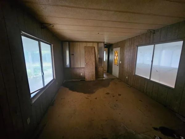 a view of hallway with windows