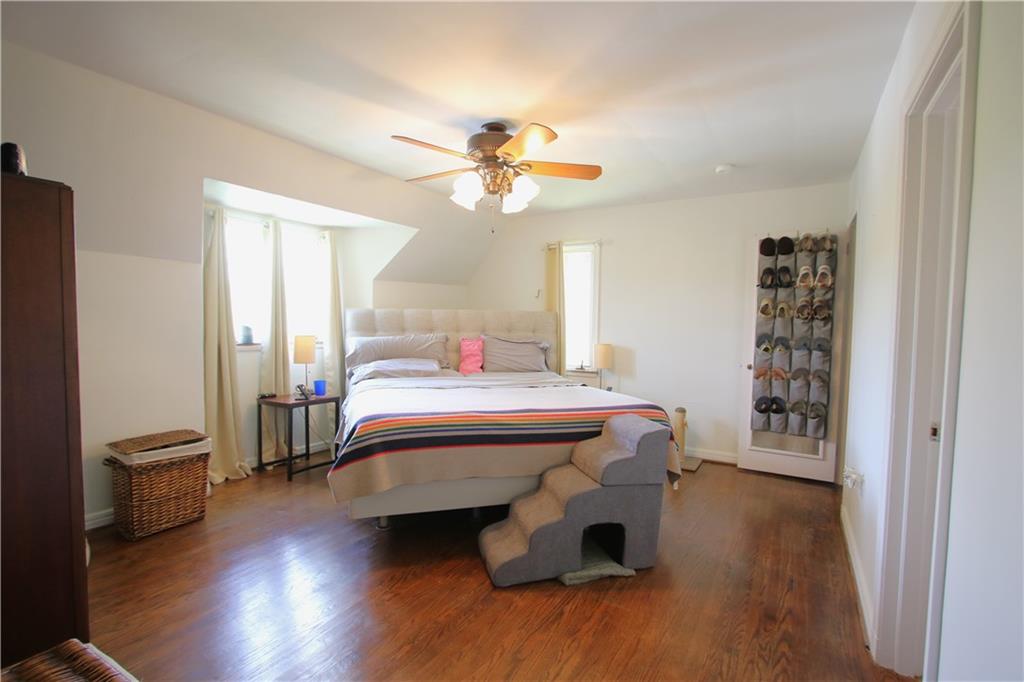 1121 Try Street Monongahela, PA 15063 - Photo 19 of 38 MASSIVE 15x13 Primary Bedroom Suite w/ 2 Deep Closets, Full Bathroom & Original Hardwood Floors & Ceiling Fan Light