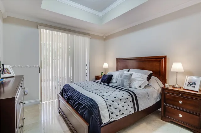 a bedroom with a bed and a lamp