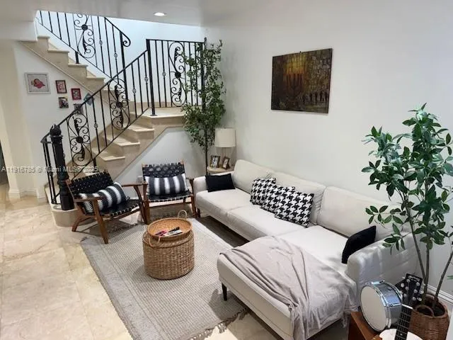 a bedroom with furniture and a potted plant