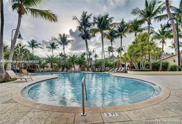 a view of a swimming pool with a table and chairs