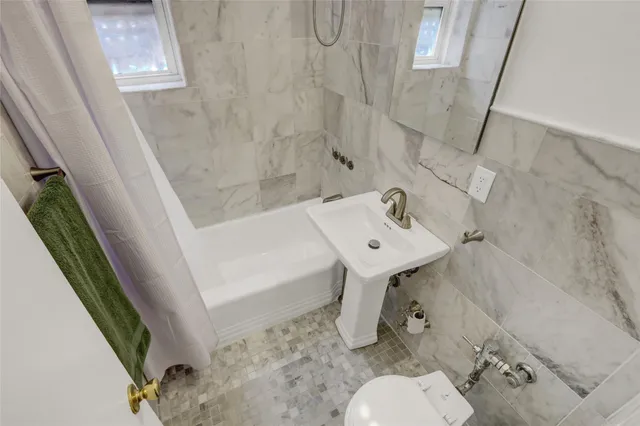 a bathroom with a sink and toilet