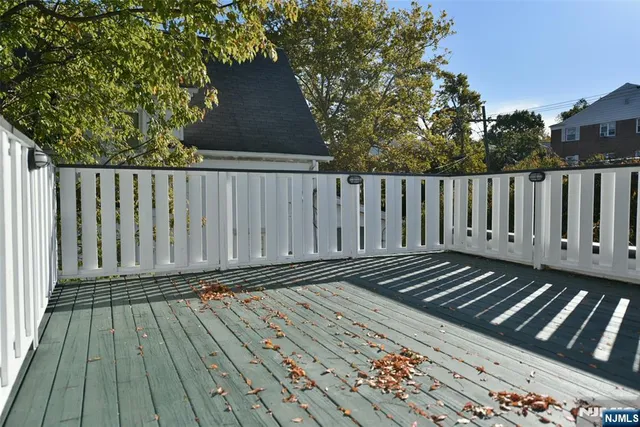 a bathroom with a double vanity sink a mirror and a bathtub