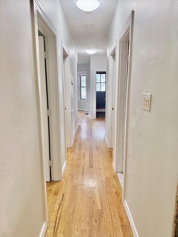 184 Boston Street, Unit 2 Boston, MA 02125 - Photo 6 of 14 a view of a hallway with wooden floor