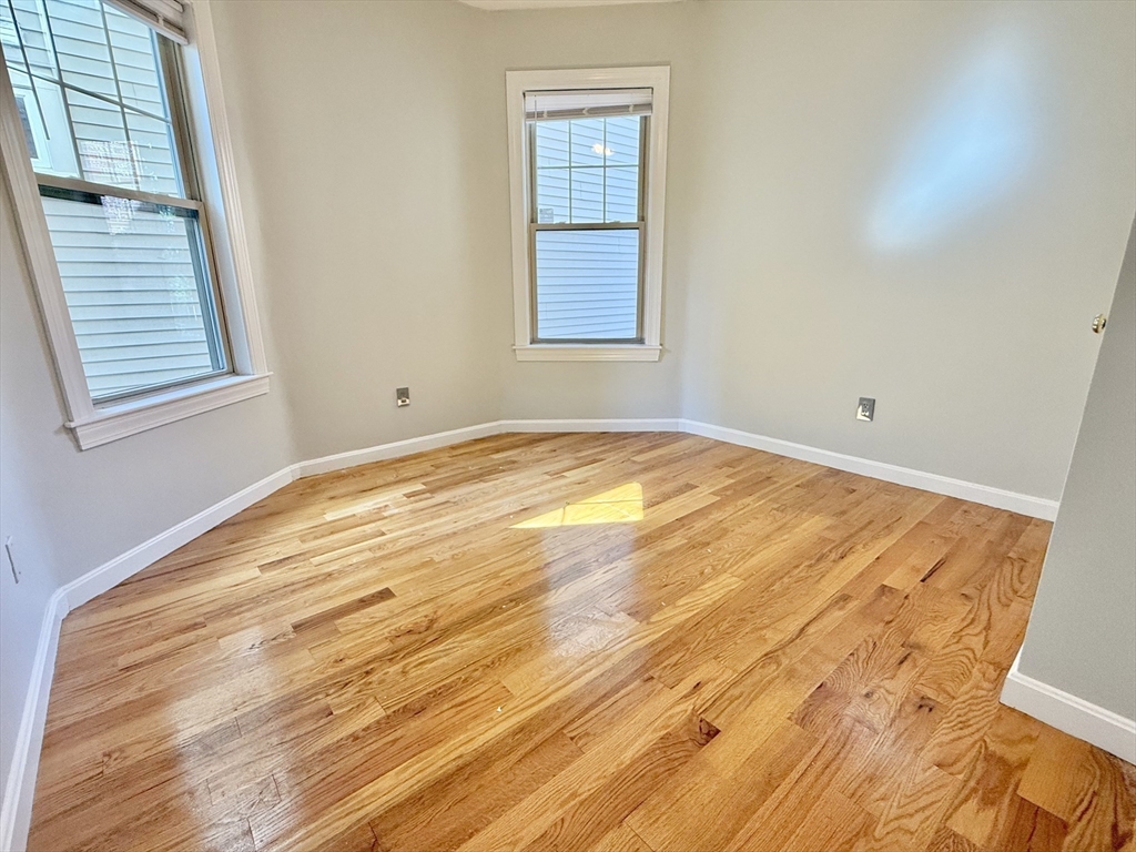 184 Boston Street, Unit 2 Boston, MA 02125 - Photo 9 of 14 a view of an empty room and window
