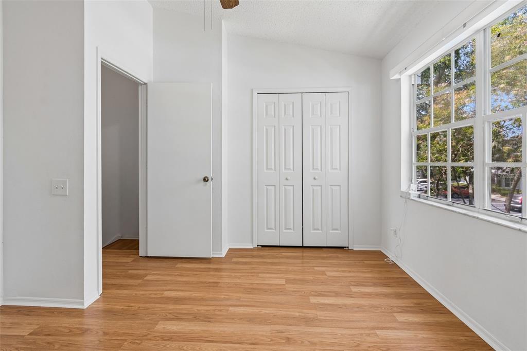 382 Countryside Key Boulevard Oldsmar, FL 34677 - Photo 29 of 58 a view of empty room with wooden floor and fan