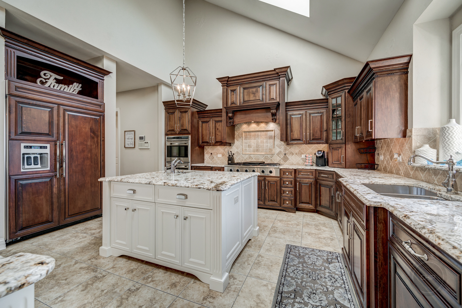 4603 Corktree Road Naperville, IL 60564 - Photo 16 of 61 a kitchen with stainless steel appliances granite countertop a sink stove and refrigerator