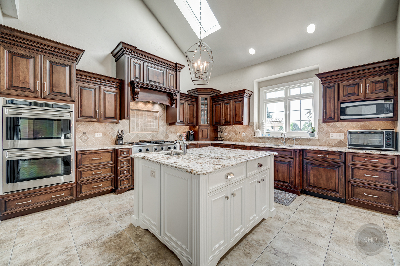 4603 Corktree Road Naperville, IL 60564 - Photo 17 of 61 a kitchen with stainless steel appliances granite countertop a stove and cabinets