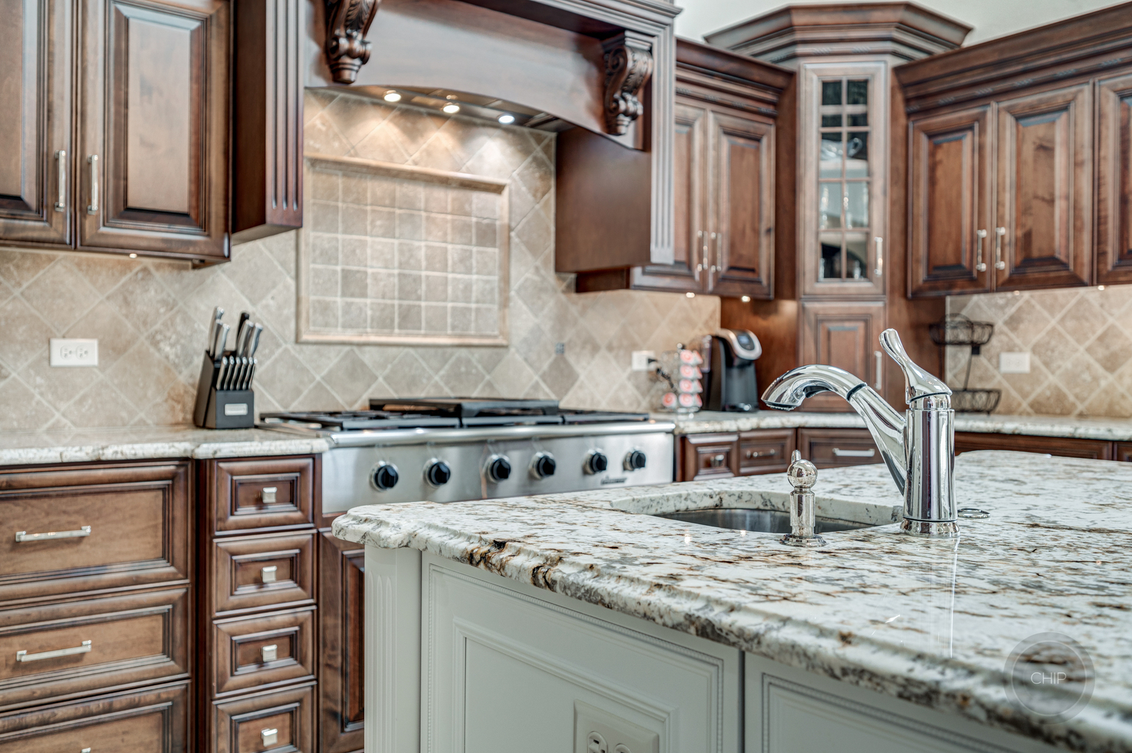 4603 Corktree Road Naperville, IL 60564 - Photo 18 of 61 a kitchen with stainless steel appliances granite countertop a sink stove and cabinets