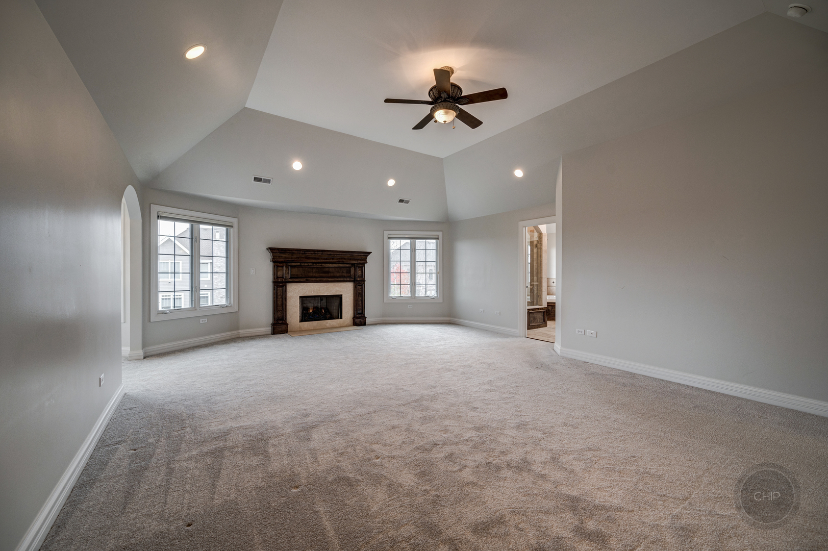4603 Corktree Road Naperville, IL 60564 - Photo 26 of 61 a view of an empty room with a fireplace and a window
