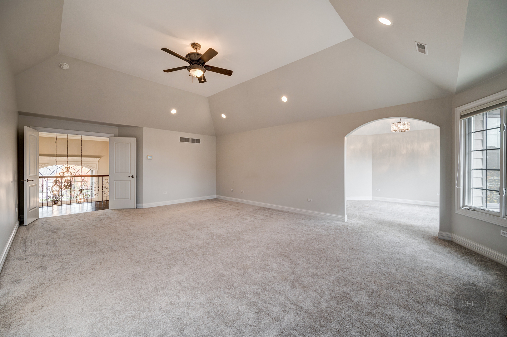 4603 Corktree Road Naperville, IL 60564 - Photo 27 of 61 a view of a livingroom with a ceiling fan and window