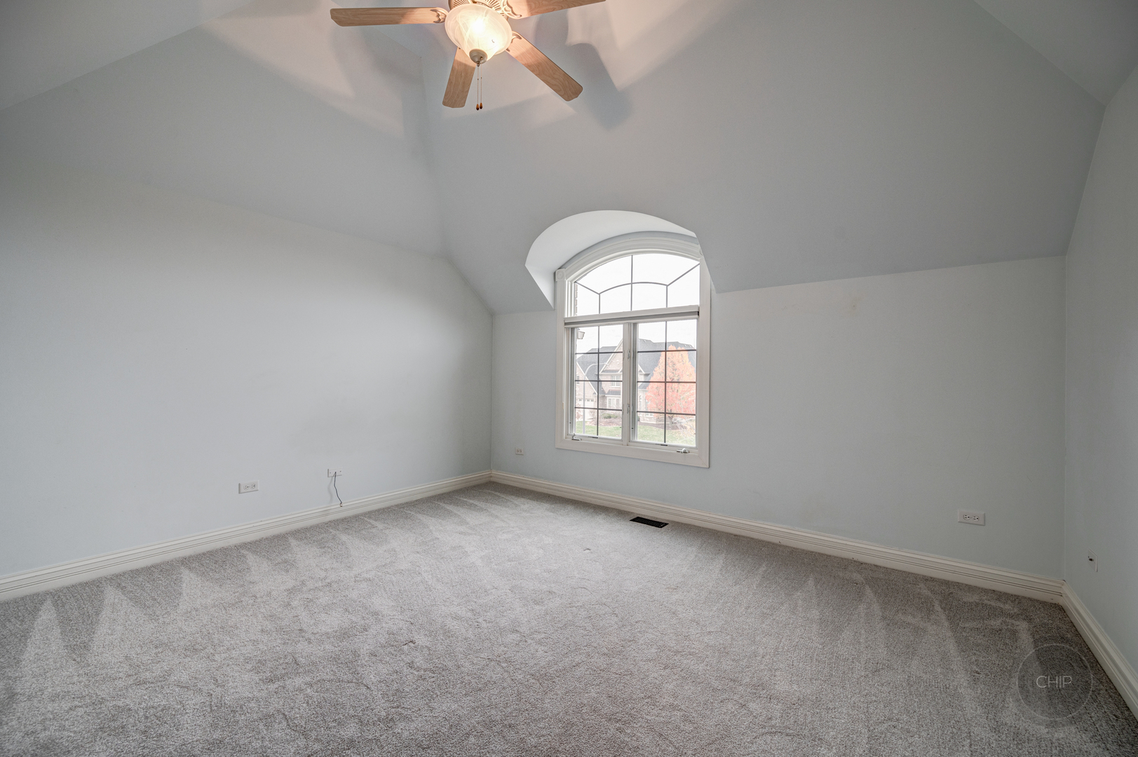 4603 Corktree Road Naperville, IL 60564 - Photo 36 of 61 an empty room with a chandelier fan and windows