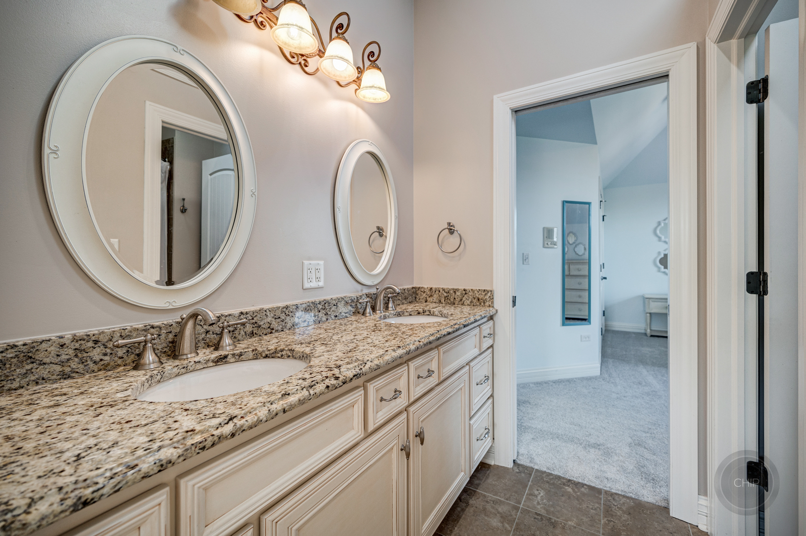 4603 Corktree Road Naperville, IL 60564 - Photo 37 of 61 a bathroom with a granite countertop double vanity sinks and a mirror