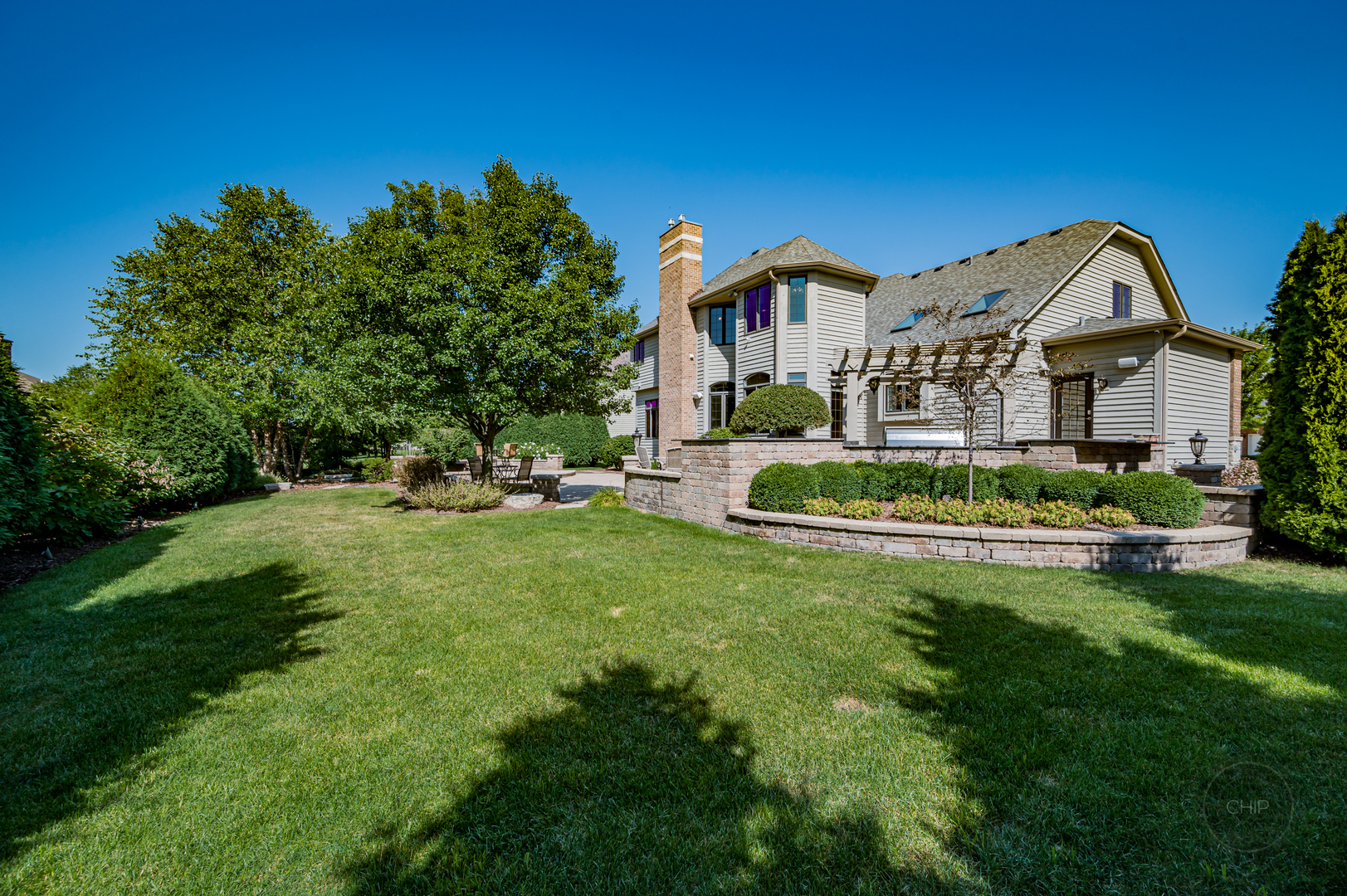 4603 Corktree Road Naperville, IL 60564 - Photo 55 of 61 a front view of a house with a yard table and chairs