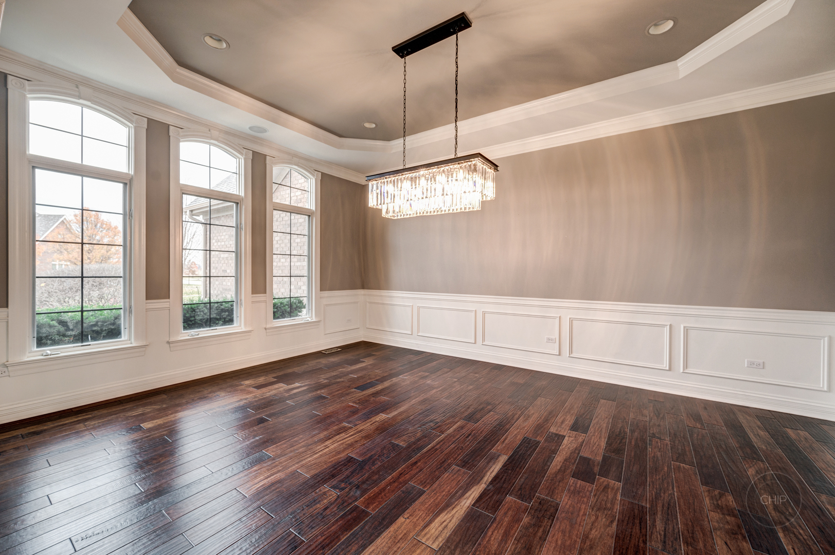 4603 Corktree Road Naperville, IL 60564 - Photo 9 of 61 a view of an empty room with wooden floor and a window
