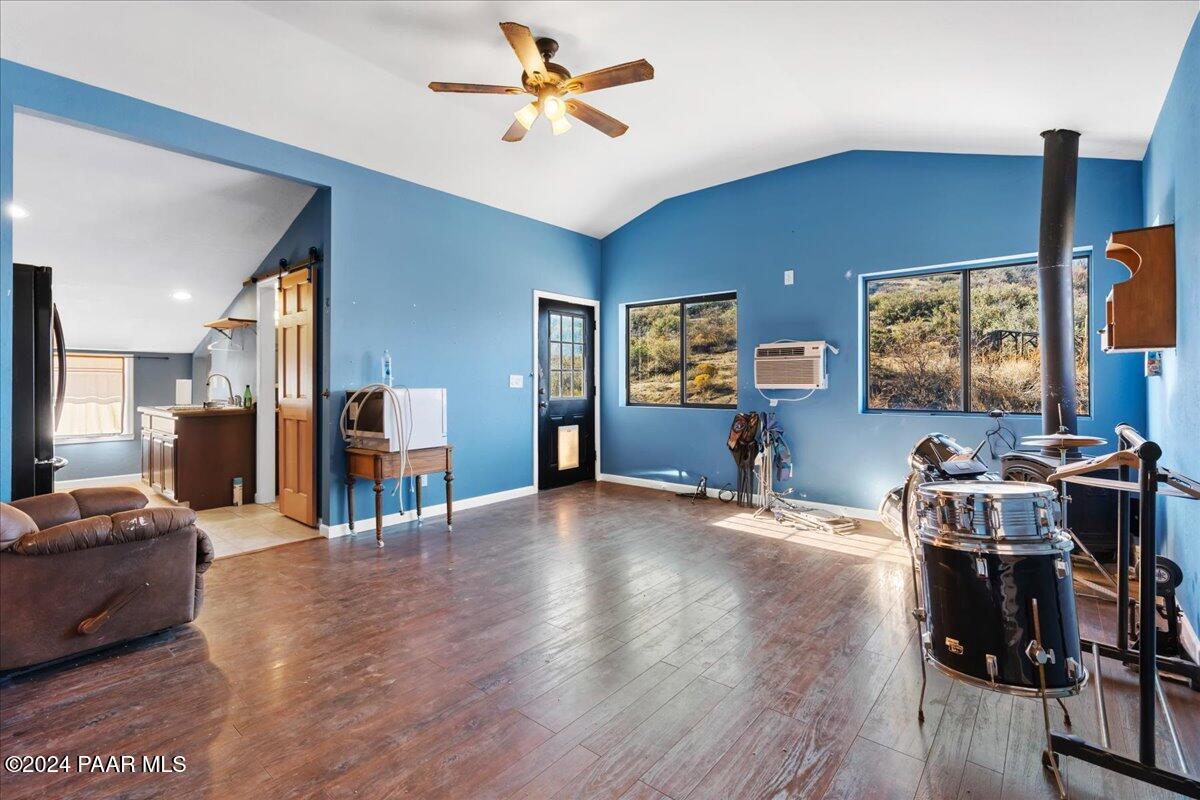 17400 Round Mountain Road Dewey, AZ 86327 - Photo 25 of 25 a living room with furniture and a flat screen tv with wooden floor
