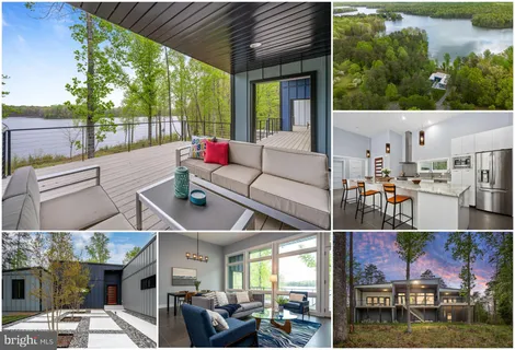 a front view of a house with a yard and potted plants