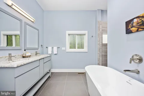 a bedroom with a large bed and a large window