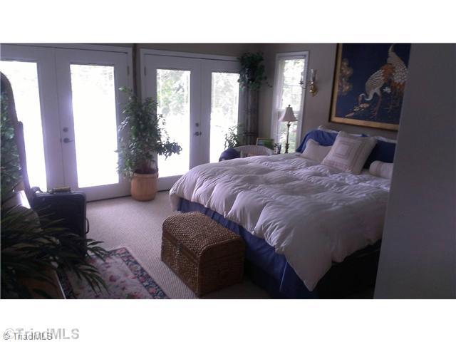 2265 Riverside Drive Lexington, NC 27292 - Photo 15 of 16 Master Bedroom. Double french doors to deck, and great lake views.