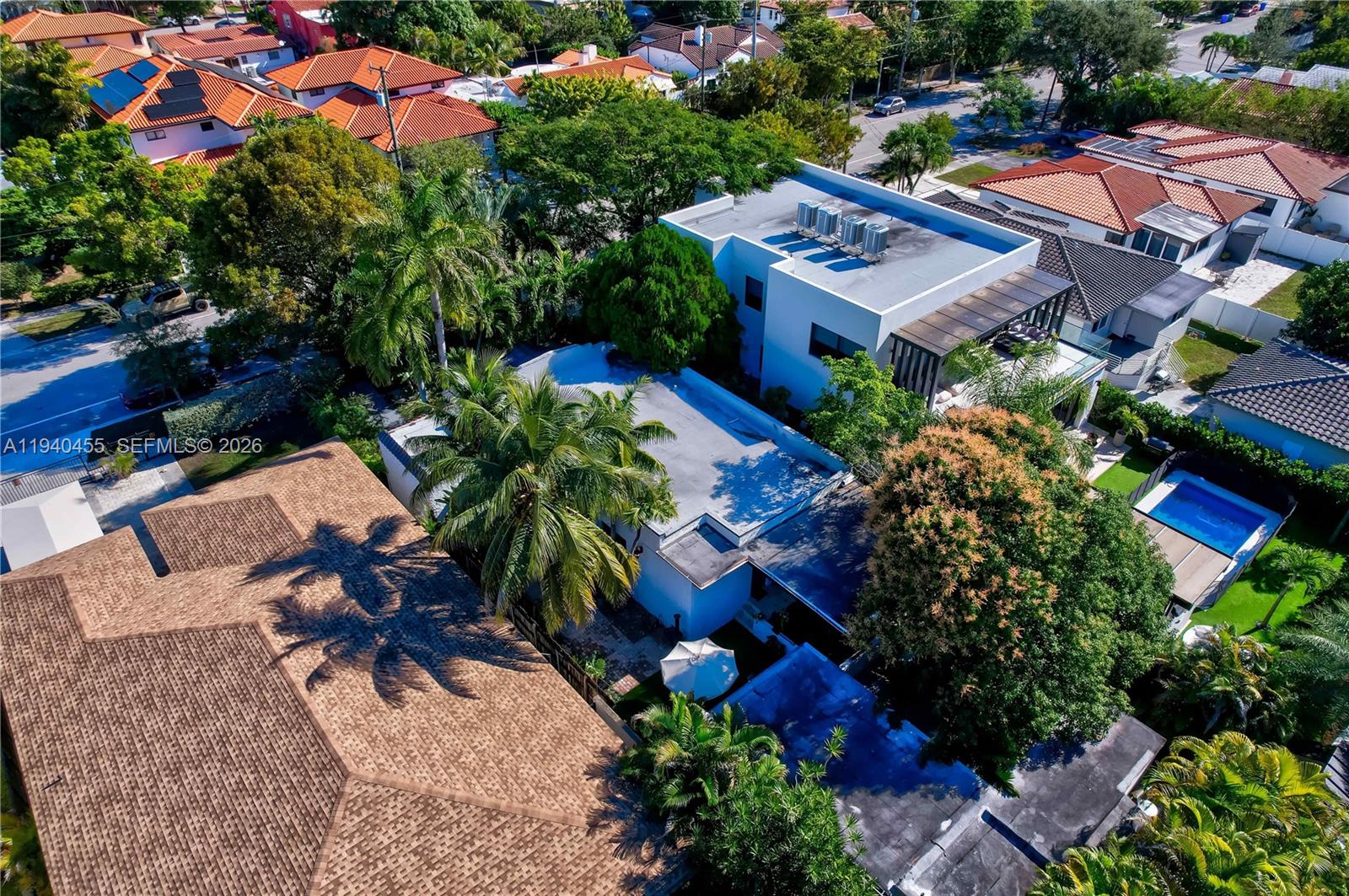 452 Southwest 21st Road Miami, FL 33129 - Photo 51 of 51 an aerial view of a house with a yard and lake view