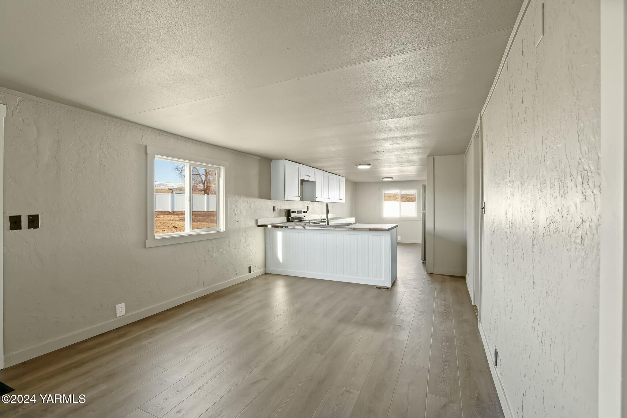 590 Hideaway Road Yakima, WA 98908 - Photo 12 of 34 a view of a kitchen with wooden floor