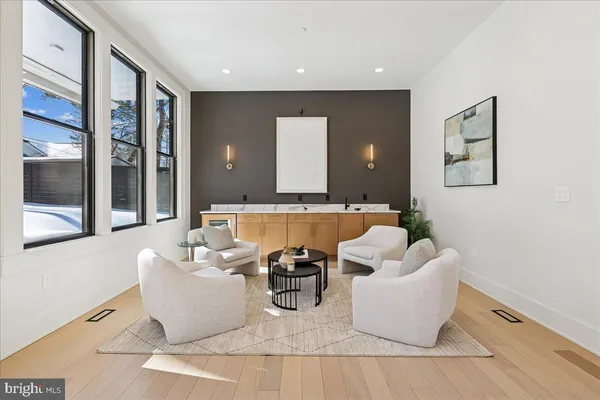 a kitchen with stainless steel appliances a sink stove and cabinets