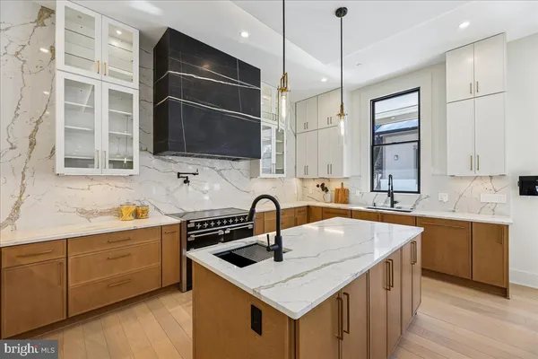 a spacious bedroom with a bed couch and a desk