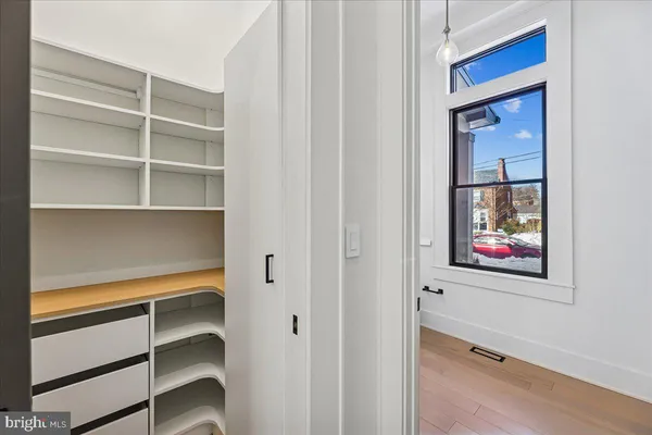 a bathroom with a large tub a sink and shower