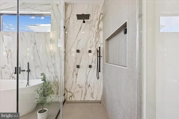 a view of a house with a yard patio and a small yard