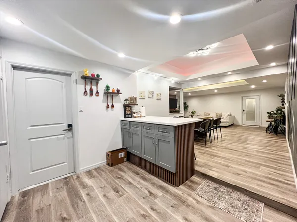a kitchen with a refrigerator and a sink