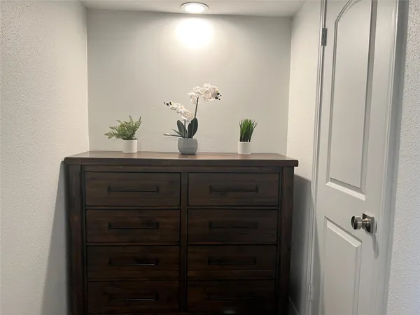 a bathroom with a sink vanity and mirror