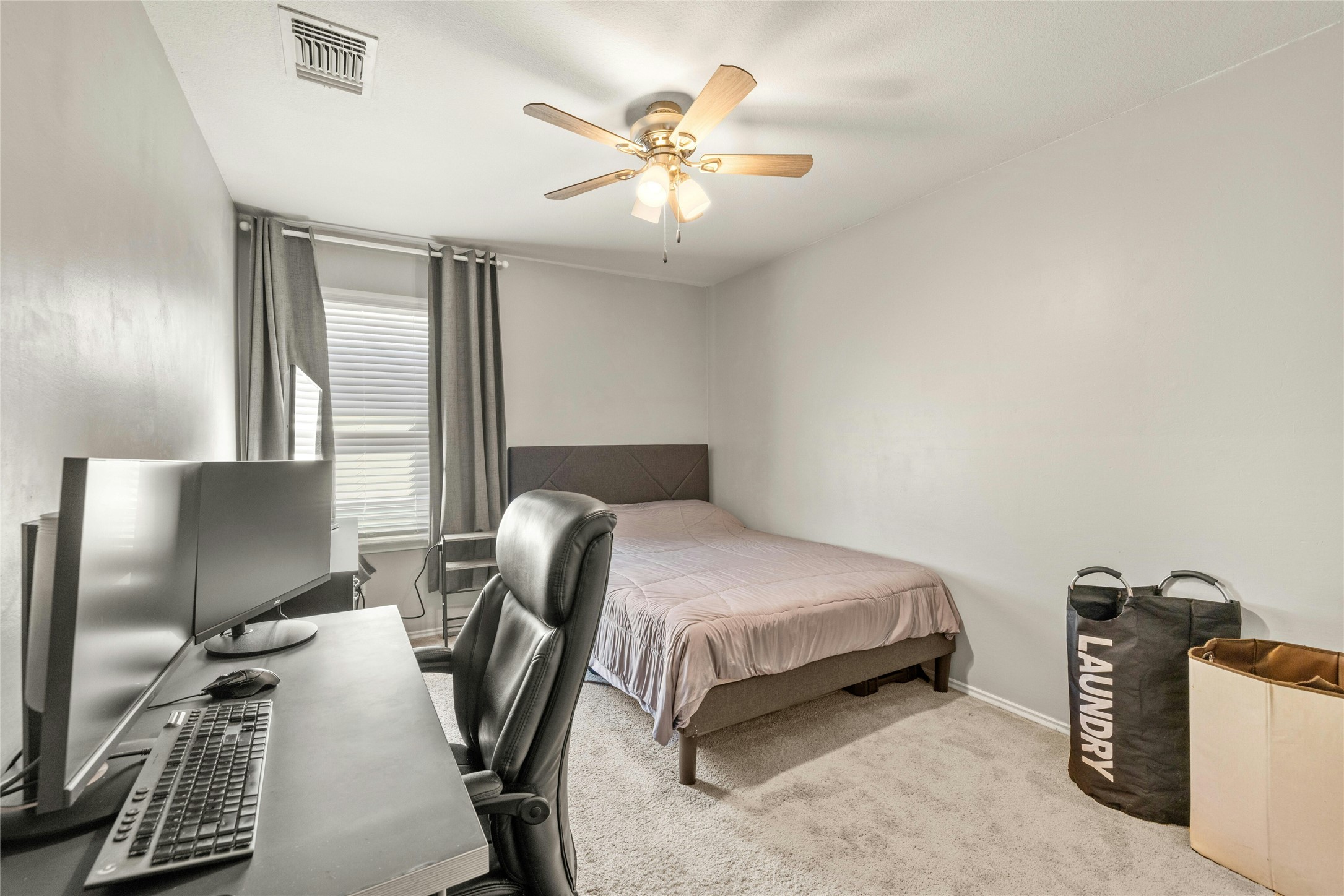 104 Bufflehead Lane Leander, TX 78641 - Photo 20 of 34 Bedroom featuring carpet floors and a ceiling fan
