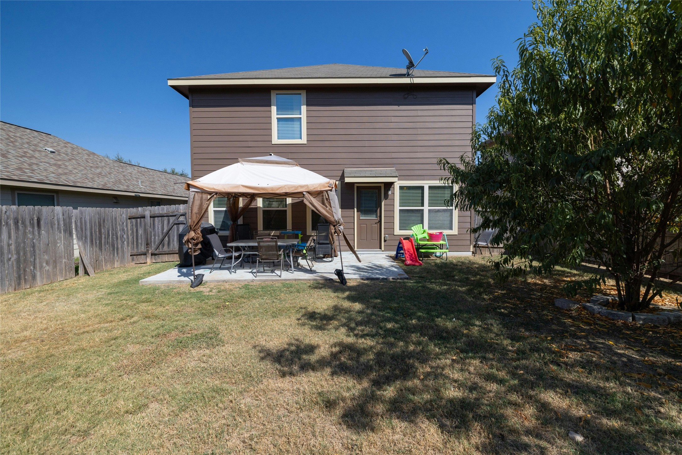 104 Bufflehead Lane Leander, TX 78641 - Photo 25 of 34 Back of property with a patio, a gazebo, and a fenced backyard
