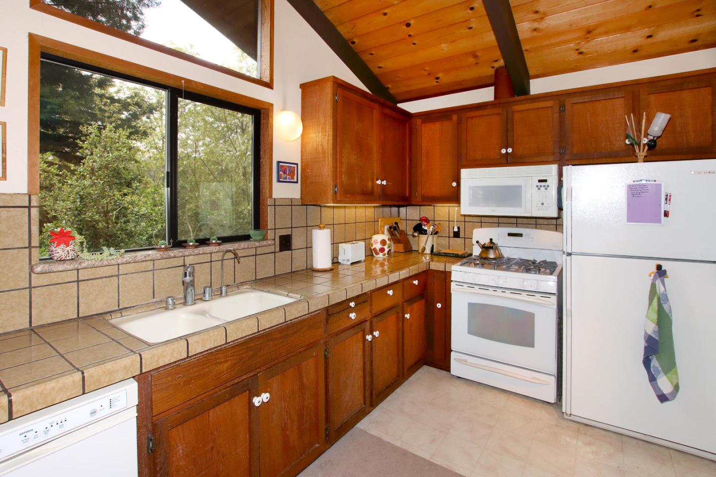 17 Pleasant Heights Drive Aptos, CA 95003 - Photo 14 of 21 a kitchen with granite countertop a sink appliances and cabinets