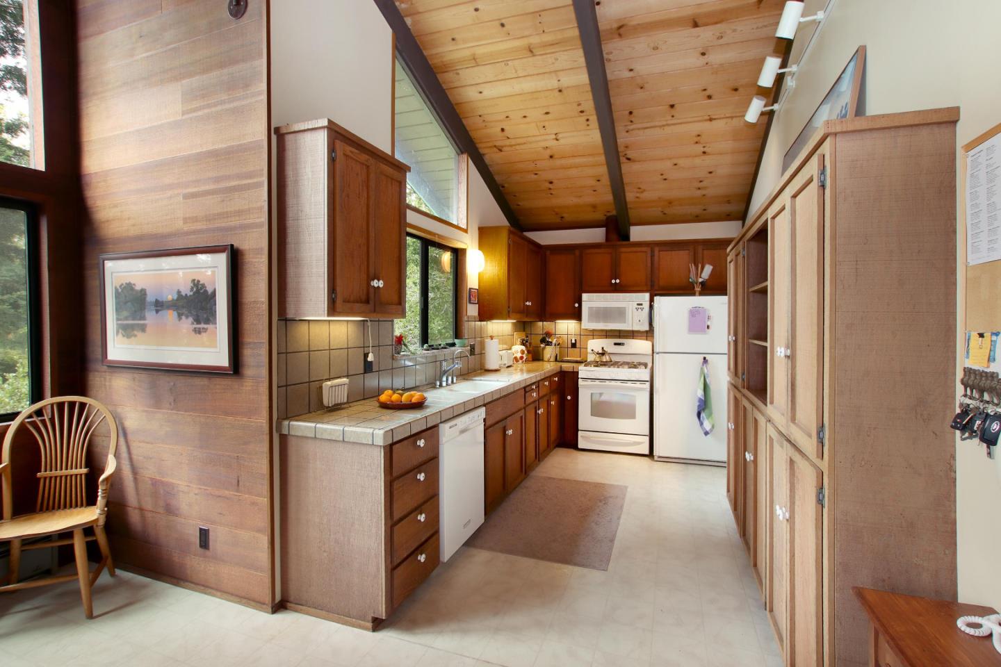 17 Pleasant Heights Drive Aptos, CA 95003 - Photo 15 of 21 a kitchen with stainless steel appliances granite countertop a stove and a refrigerator